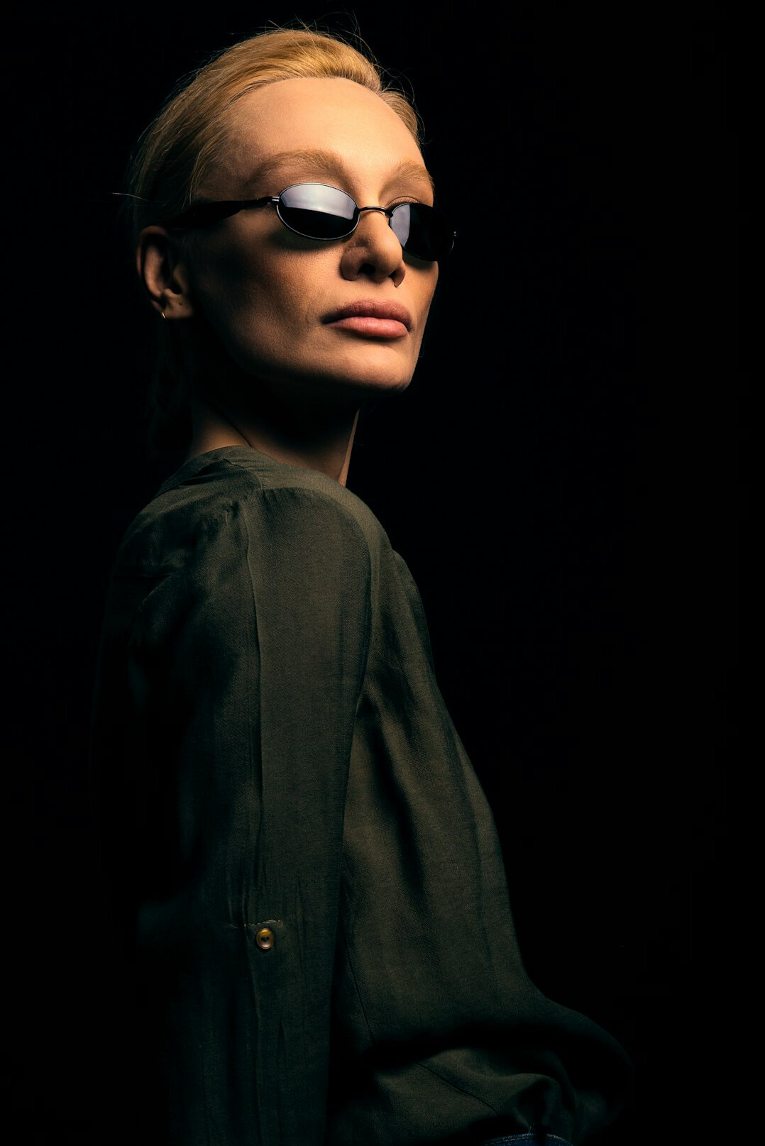 Studio portrait of a professional woman with glasses