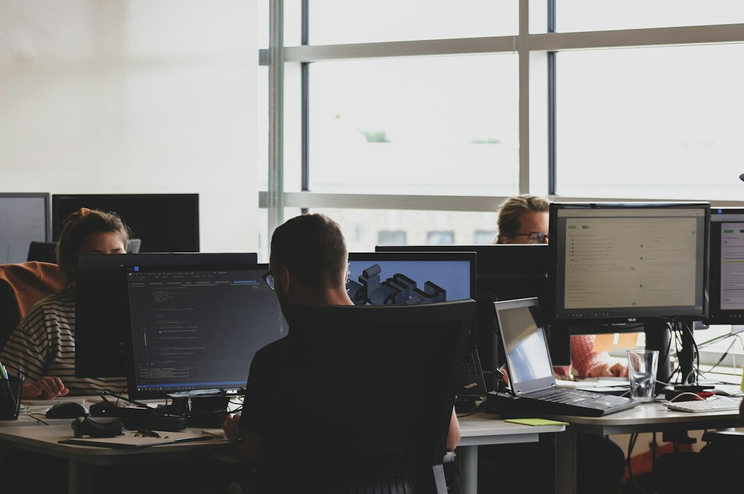 group of developers reviewing code
